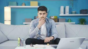 The young man tries his new perfume at home, liking and approving the scent. video