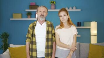 Father and daughter looking at camera and saying wow. video