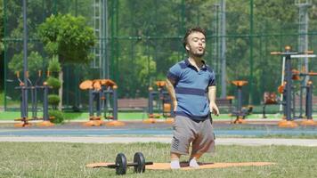 Sporty dwarf young man doing breathing exercise. Inhale and exhale. video