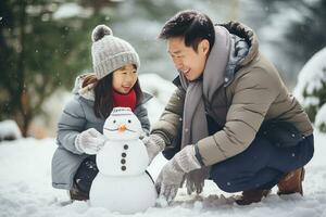 Asian family, father and daughter building a snowman together on winter day. Happy family having fun while playing in snow outdoors. Generative AI. photo