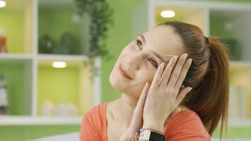 Close-up thoughtful young woman thinking positive, feeling happy. video