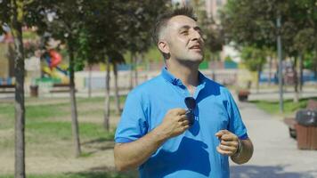 The man dancing outside is happy and cheerful. video