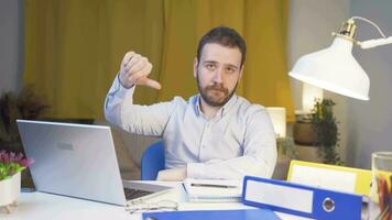 Home office worker man making negative gesture at camera. video