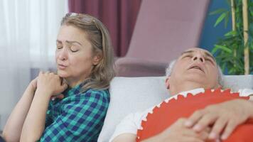 Thoughtful woman at the bedside of her sick husband. Sad. video