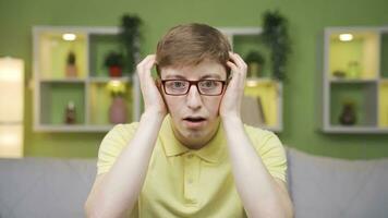 Close-up portrait of funny shocked young man. video