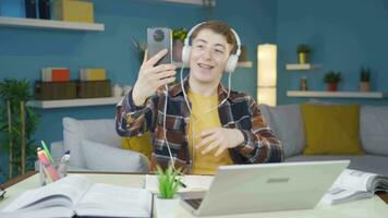 Student dancing to the music on the phone. video