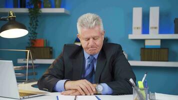 Businessman shrinking and depressed at work. video