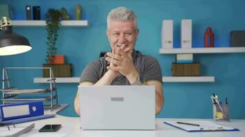 Home office worker man looking at camera clapping and getting excited. video