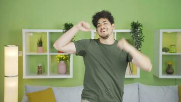 Portrait of fun and happy young man dancing. video