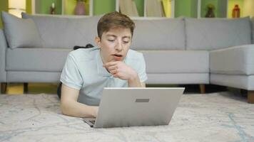 Young man talking facetime on laptop at home. video