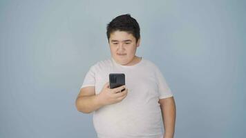 Boy making a video call on the phone.