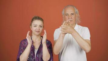 Couple making a sign of confidence at the camera. Confidence message. video