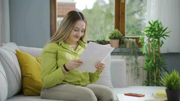 The young woman who rejoices in good content paperwork. video