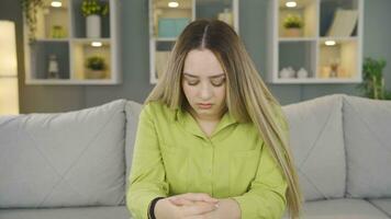 The grieving young woman is thinking and suffering from depression. video