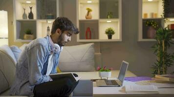 A student studying with a friend over video call.