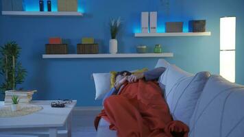 The man trying to sleep at home cannot sleep. He has a sleep problem. video