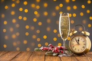 Wine glass with bubbly Champagne on blurry sparkling lights background photo