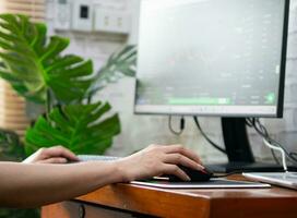 Woman analyzing graphs in progress money on the table doing work photo