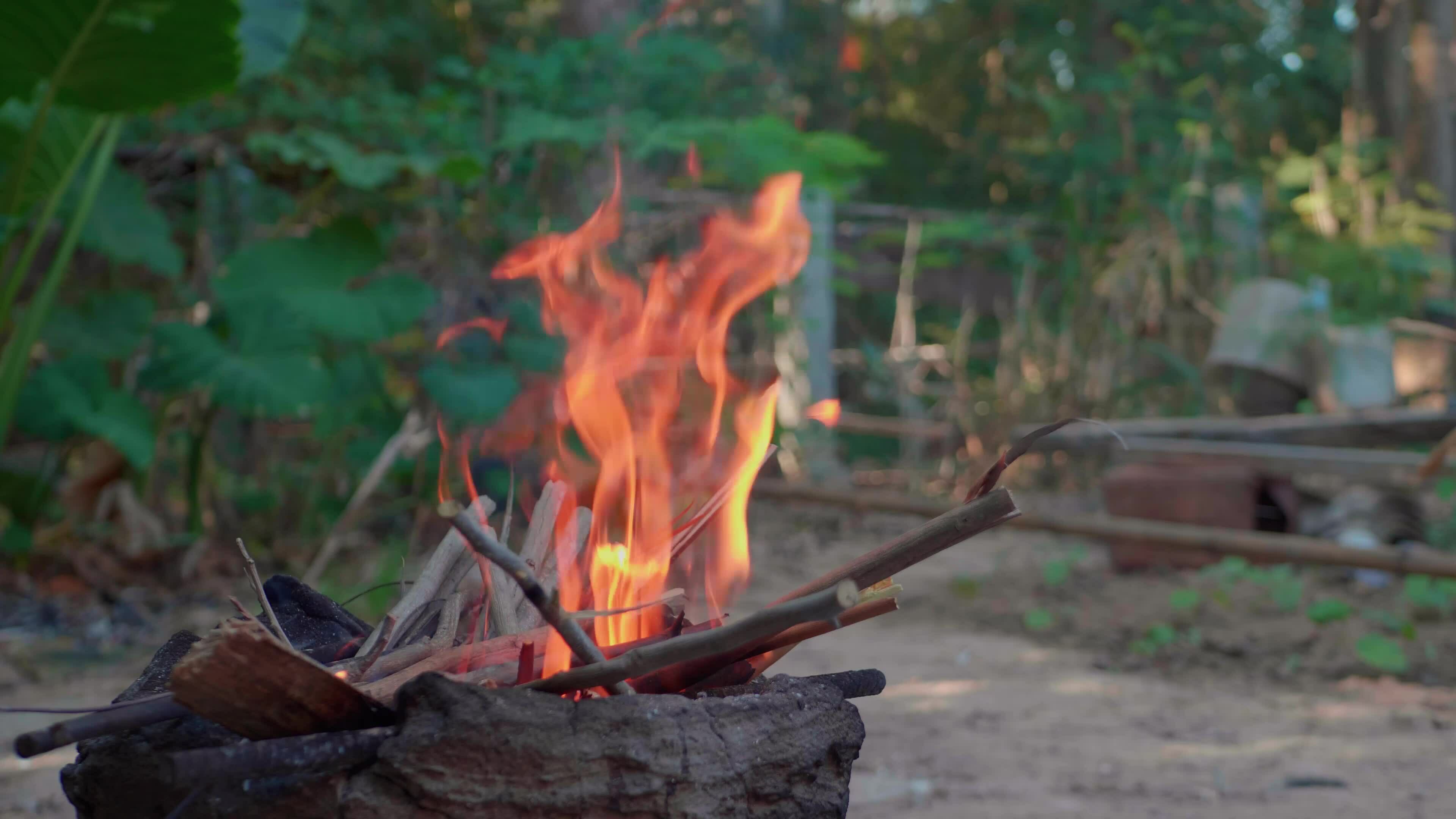 Light a fire to cook rice using firewood as fuel. 33063367 Stock Video