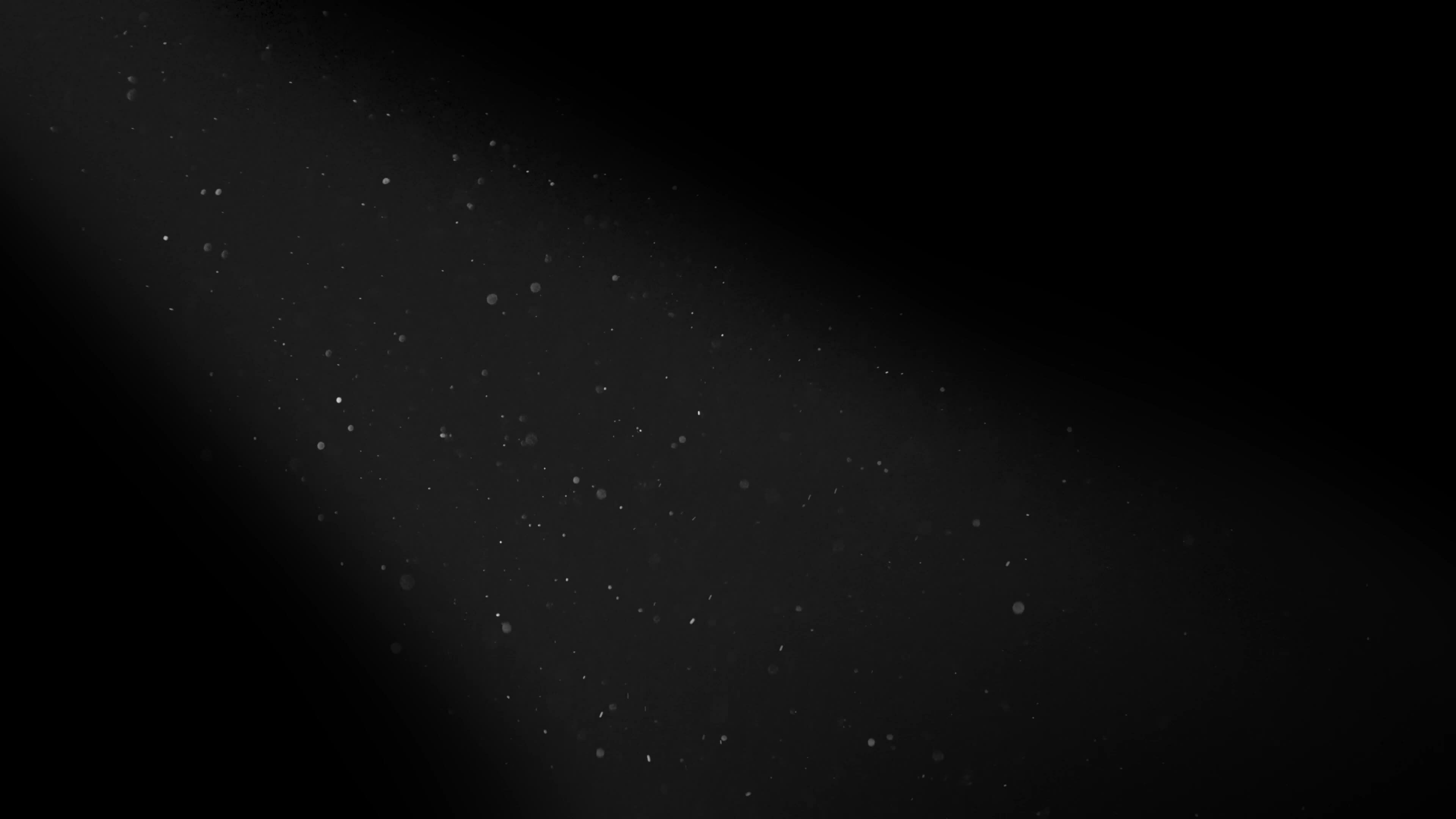 Dust particles in a light beam ray filmed with RED camera in 4K in slow