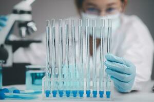 Medical Development Laboratory, biochemical research scientist Asian Doctor working with a microscope for vaccine development in the pharmaceutical research laboratory, Biotechnology Specialist photo