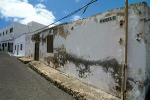 a white building with a sign on it photo