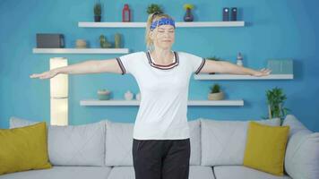Woman doing arm exercises at home. video