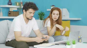 Married couple engaged in home economics. video