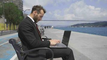 Businessman focused on his work working on his laptop. Slow motion. video