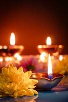 Happy Diwali. Traditional symbols of Indian festival of light. Burning diya oil lamps and flowers on red background. photo