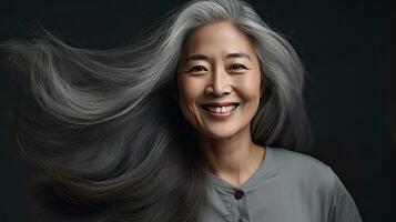 Beautiful aging mature asian woman with long gray hair and happy smiling touch face. Beauty and cosmetics skincare advertising concept. Generative Ai photo