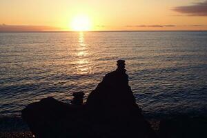 picturesque ocean landscape with the setting sun in a tropical country during summer holidays photo