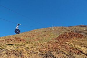 volcanic landscape with a cable car to the top of the mountain of the Spanish Teide volcano on Tenerife, Canary Islands photo