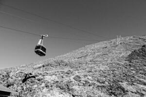 volcanic landscape with a cable car to the top of the mountain of the Spanish Teide volcano on Tenerife, Canary Islands photo