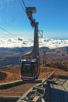 volcanic landscape with a cable car to the top of the mountain of the Spanish Teide volcano on Tenerife, Canary Islands photo