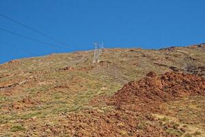 volcanic landscape with a cable car to the top of the mountain of the Spanish Teide volcano on Tenerife, Canary Islands photo