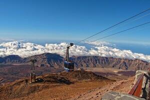 volcanic landscape with a cable car to the top of the mountain of the Spanish Teide volcano on Tenerife, Canary Islands photo