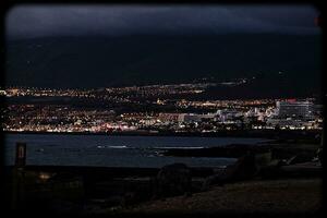 night landscape on the Spanish island of Tenerife with the ocean in the background photo