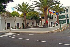 scenery with the city's characteristic white buildings from the Spanish island of Lanzarote on a warm summer day photo