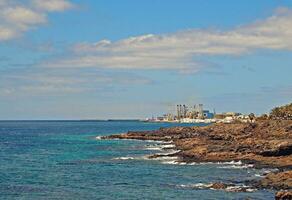 seaside landscape with ocean beach and blue sky on the island of Lanzarote in spain photo