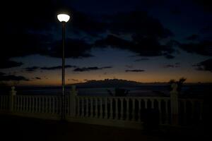 picturesque ocean landscape with the setting sun in a tropical country during summer holidays photo