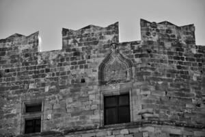 old antique stone ruins on a hot summer day on the Greek island of Rhodes in Lindos photo