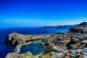 summer landscape of the Greek island of Rhodes with blue cloudless sky and sea photo