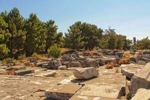 old ruins of the ancient temple of Athena in Priene in Turkey on a hot summer day photo