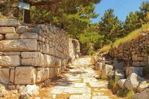 old ruins of the ancient temple of Athena in Priene in Turkey on a hot summer day photo