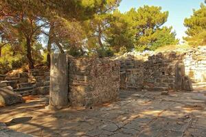 old ruins of the ancient temple of Athena in Priene in Turkey on a hot summer day photo