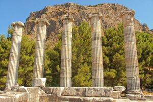 old ruins of the ancient temple of Athena in Priene in Turkey on a hot summer day photo