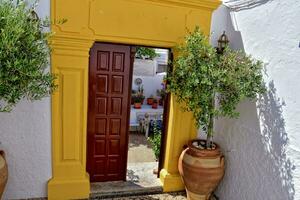 landscape from the historic city of lindos on the greek island of rhodes with white old tenement houses photo