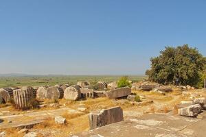 old ruins of the ancient temple of Athena in Priene in Turkey on a hot summer day photo