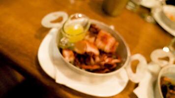 Zoom in on a plate with fried squid seafood in restaurant video